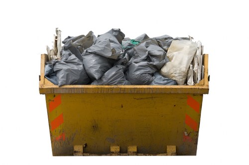 Residents disposing of old furniture at a recycling center in Tufnell Park